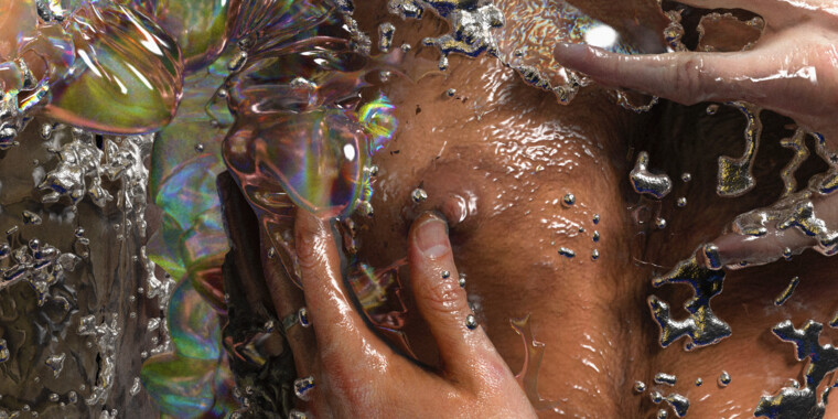 Kunstfoto einer nackten Brust, die von Händen berührt wird. Sie scheint sich unter Wasser zu befinden, die Flüssigkeit schillert bunt.